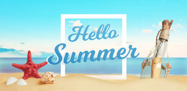 istock Hello summer text on beach sand surrounded by sea star, shells and message in the bottle. Tropical vacation concept 1392087682