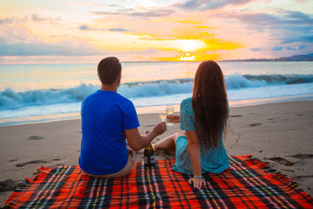 istock Family having a picnic on the beach 1392089102