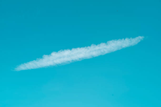 istock White fluffy cloud in the blue sky in spring. 1392089237