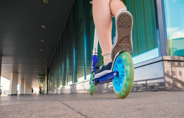 istock Woman on kick scooter. 1392091694