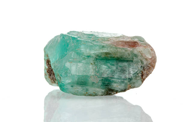 istock macro mineral stone emerald on a white background 1392093597