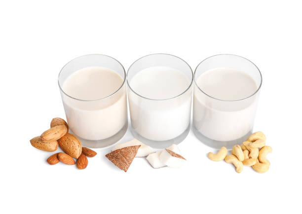 istock Vegan milk and different nuts on white background 1392094711