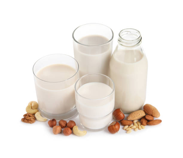 istock Vegan milk and different nuts on white background 1392094784
