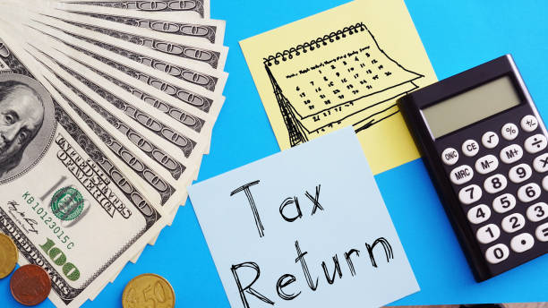 istock Tax return is shown on the photo using the text 1392096055