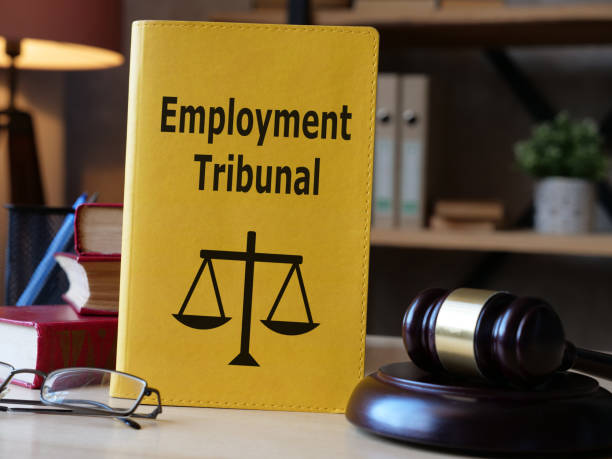 istock Employment tribunal is shown on the book using the text 1392096382