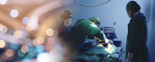 Defibrillation cardiac dysrhythmia, Surgical doctor team performing surgery patient on operating room in hospital stock photo