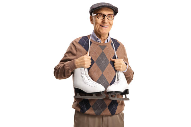 istock Elderly man with ice skates hanging around his neck 1392097733