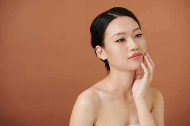 istock Woman Touching Soft Skin 1392097846