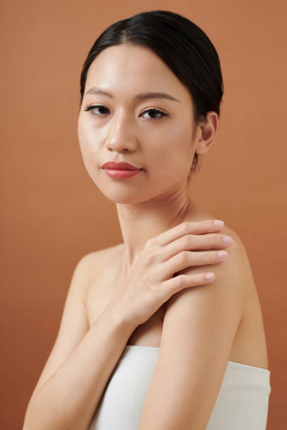 istock Young Woman Wrapped in Towel 1392097861