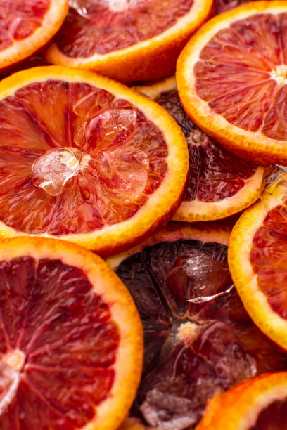 istock Background with blood oranges and ice 1392098824