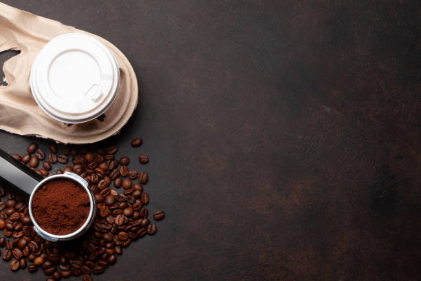 istock Takeaway cup, roasted coffee beans and ground coffee in holder 1392103832