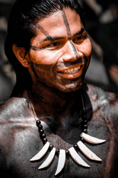 Portrait of one Yugambeh Aboriginal man with body paint during Aboriginal culture show in Queensland, Australia.