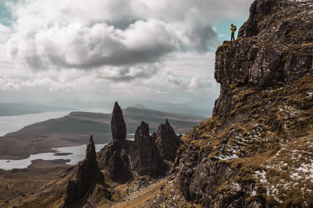 istock Man hikes on a solo adventure in mountain 1392106684