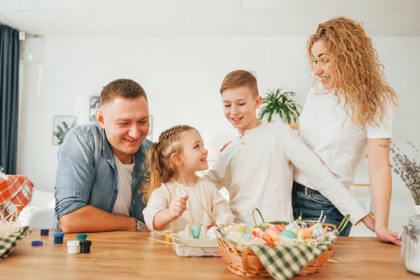 istock On the kitchen. Happy family celebrating Easter holidays together 1392106939