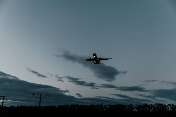 istock Airplane approaching landing at the airport 1392107100