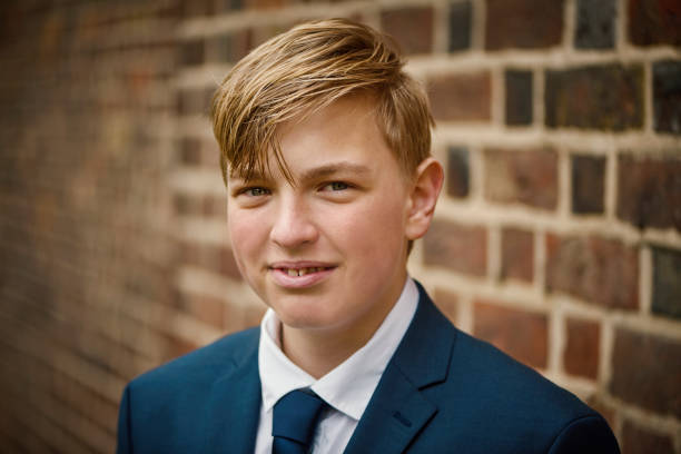 istock Teenager dressed for his communion 1392107117