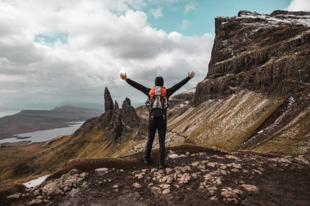 istock Man hikes on a solo adventure in mountain 1392107173