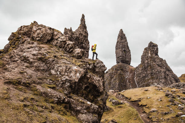 istock Man hikes on a solo adventure in mountain 1392107693
