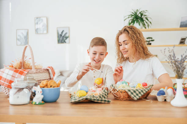 istock Happy mother and son celebrating Easter holidays together 1392108788
