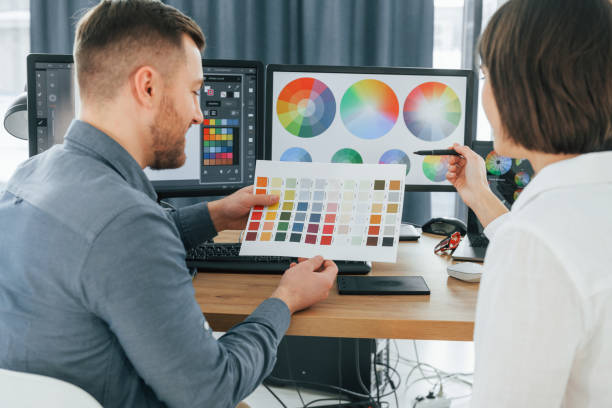 istock Talking with each other about new ideas. Two designers working together in the office 1392110814