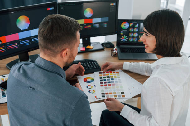 istock Top view. Two designers working together in the office 1392110883