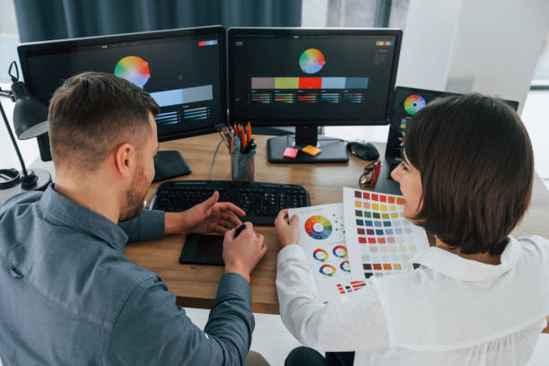 istock Positive communication. Two designers working together in the office 1392110885