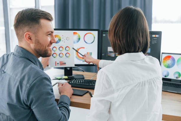 istock Positive communication. Two designers working together in the office 1392110893