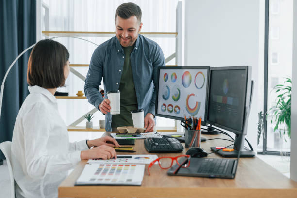 istock Professional team. Two designers working together in the office 1392110975