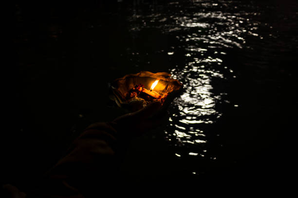 istock devotee holding aarti flower pot for ganges river evening prayer at night 1392112166