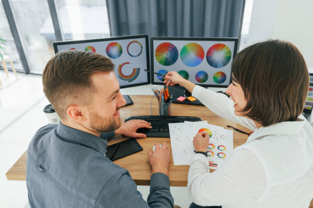 istock Two designers working together in the office 1392112382