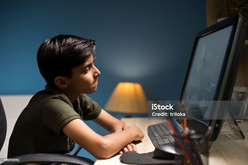 Computer Use For Boy Boy Using Computer At Home Stock Photo - Download Image Now - Child ...