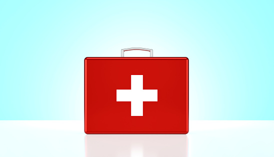 First Aid Kit On Blue Background