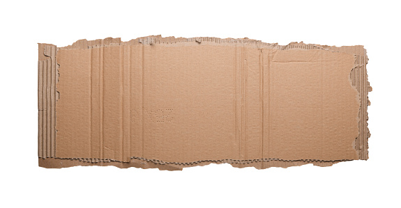 Piece of torn cardboard on a white background.Torn wrinkled cardboard used as a background design element.