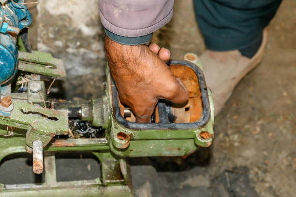 istock plumber repairing the old classic water pump 1392116005