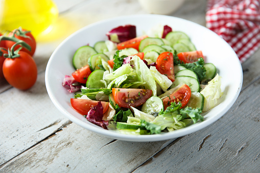 Healthy green salad with tomato and cucumber