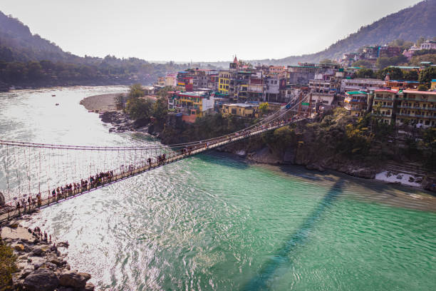istock lakshman jhula iron suspension bridge over ganges river from flat angle 1392117941