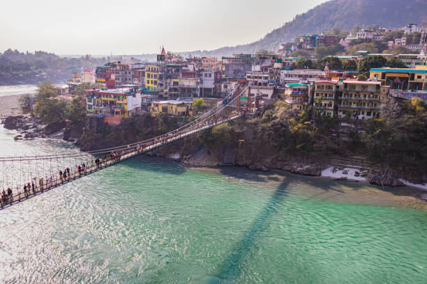 istock lakshman jhula iron suspension bridge over ganges river from flat angle 1392117992