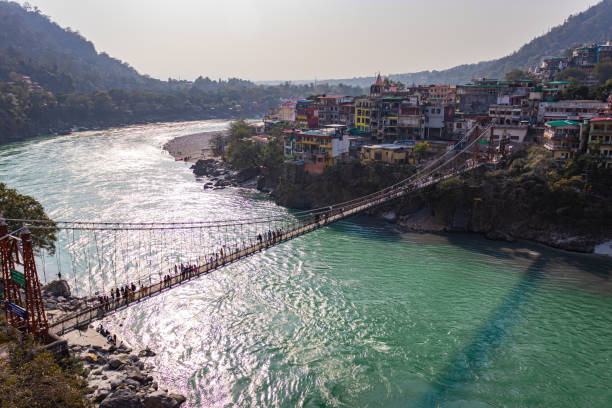 istock lakshman jhula iron suspension bridge over ganges river from flat angle 1392118190