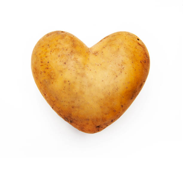 istock Heart-shaped potato isolated on a white background 1392118420
