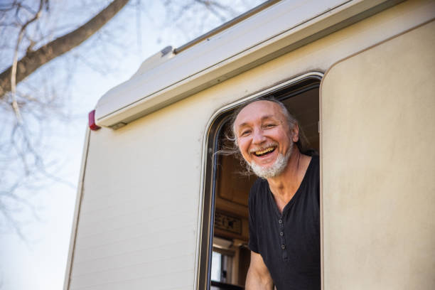 istock Caucasian man getting out from the camper van 1392118538