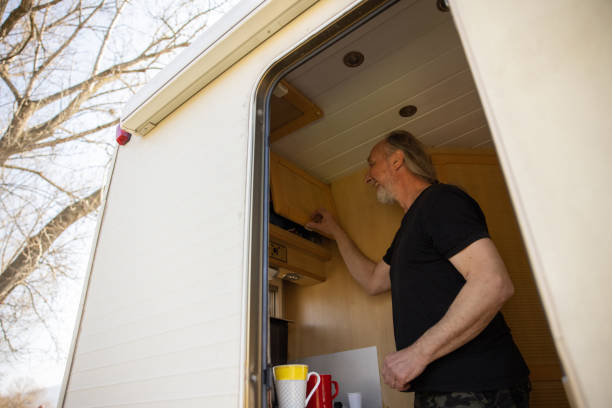istock Caucasian man making a coffee at his camper van 1392118541