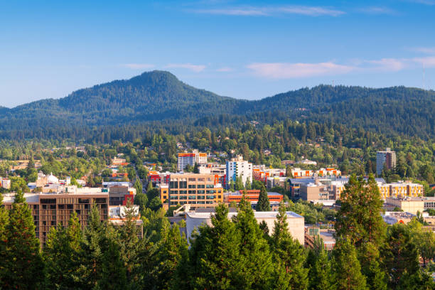 Eugene, Oregon, USA Downtown Cityscape and Mountains Eugene, Oregon, USA downtown cityscape and mountains in the afternoon. eugene oregon stock pictures, royalty-free photos & images