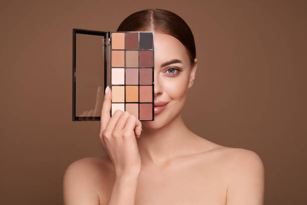 istock Beauty woman with eye shadow makeup palette 1392122367