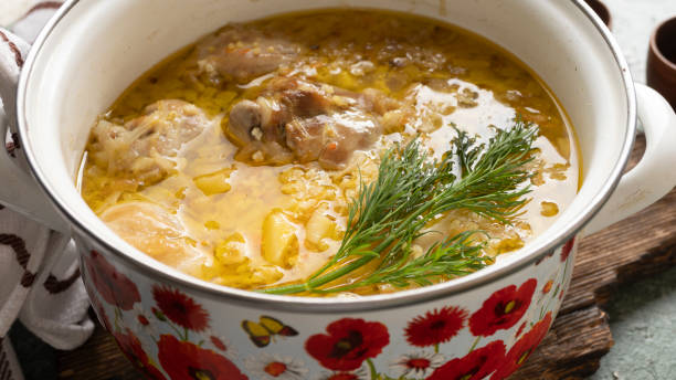 istock Delicious german soup eintopf with chicken and sauerkraut 1392122378