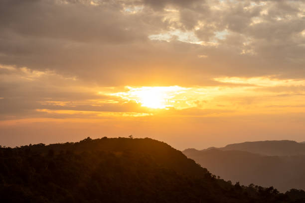 istock dramatic sunset orange sky over mountain shadow at morning from flat angle 1392122442