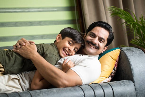 istock Father and son having fun at home 1392122809