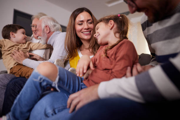 istock Playful extended family having fun at home. 1392123593