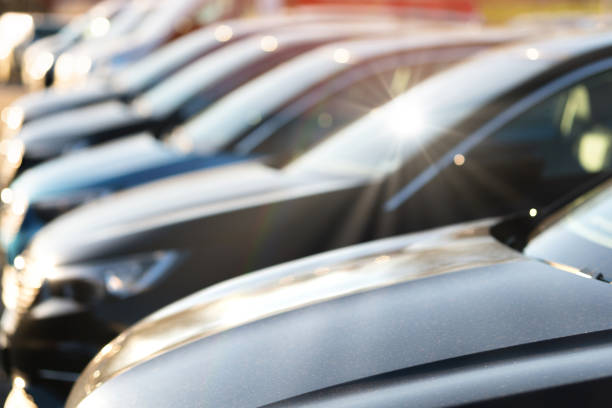New cars at a car dealership Close up of brand new cars at a car dealership car finance stock pictures, royalty-free photos & images