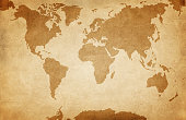 istock World map on old grunge paper background 1392125008