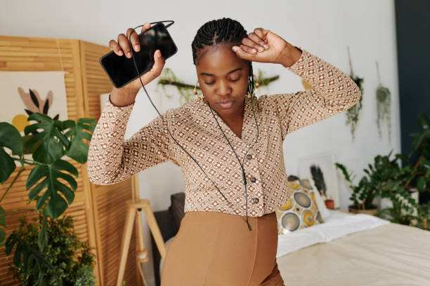 Pregnant woman dancing at home